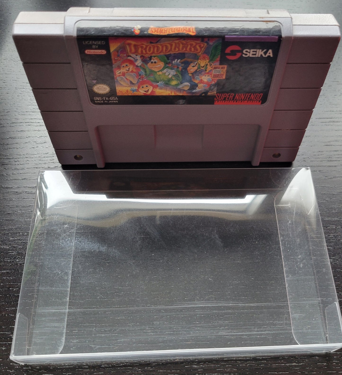 TRODDLERS Authentic - SNES - Super Nintendo Ent. System NTSC Cartridge + Protector