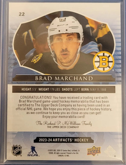 2023 Upper Deck Artifacts Gold Dual Jersey 22 Brad Marchand Numbered 181/249