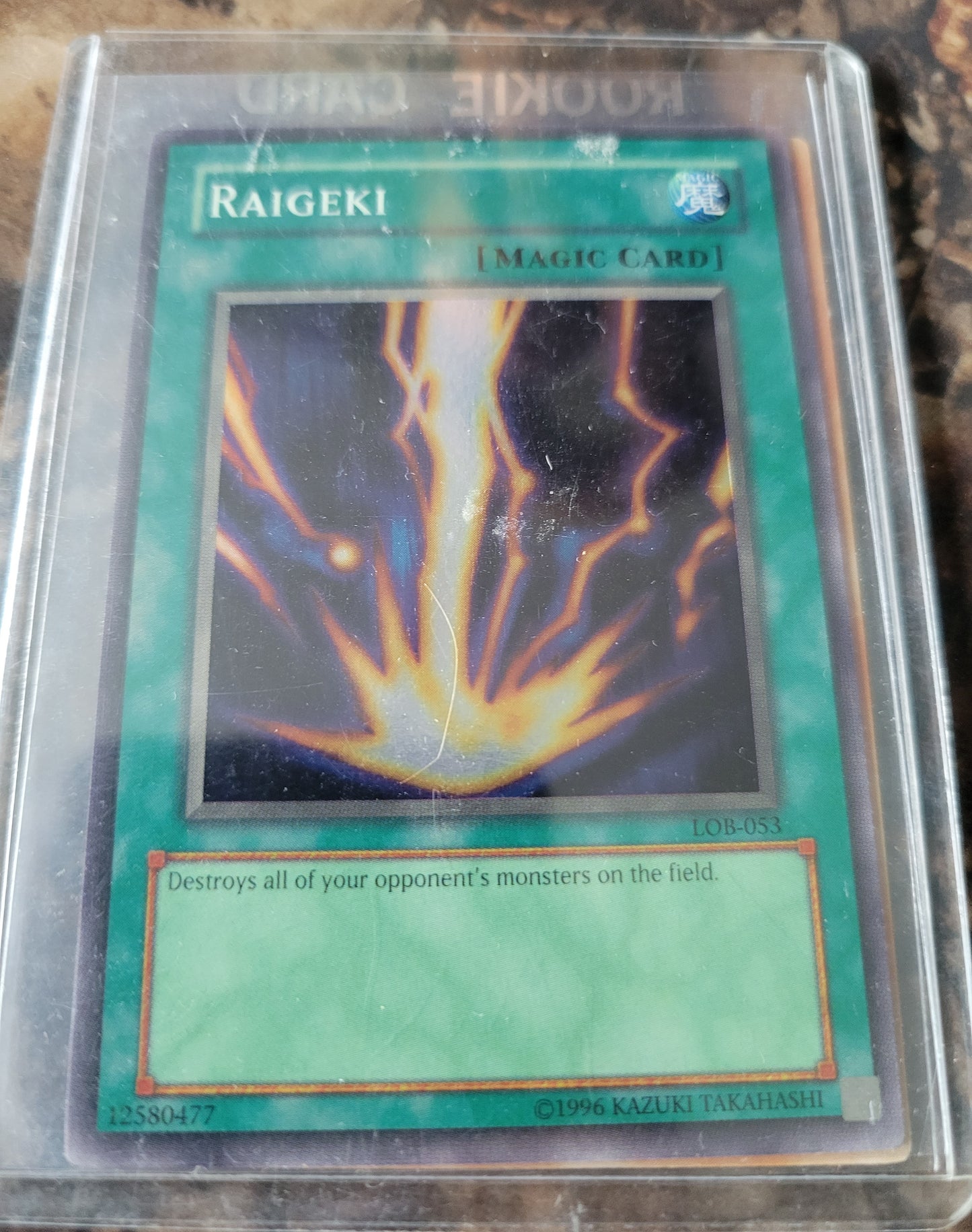 Authentic 1999 Edition LOB-053 "RAIGEKI" Yugioh Card Ultra Rare Holographic Limited Edition Near Mint Plastic Sleeve Since New