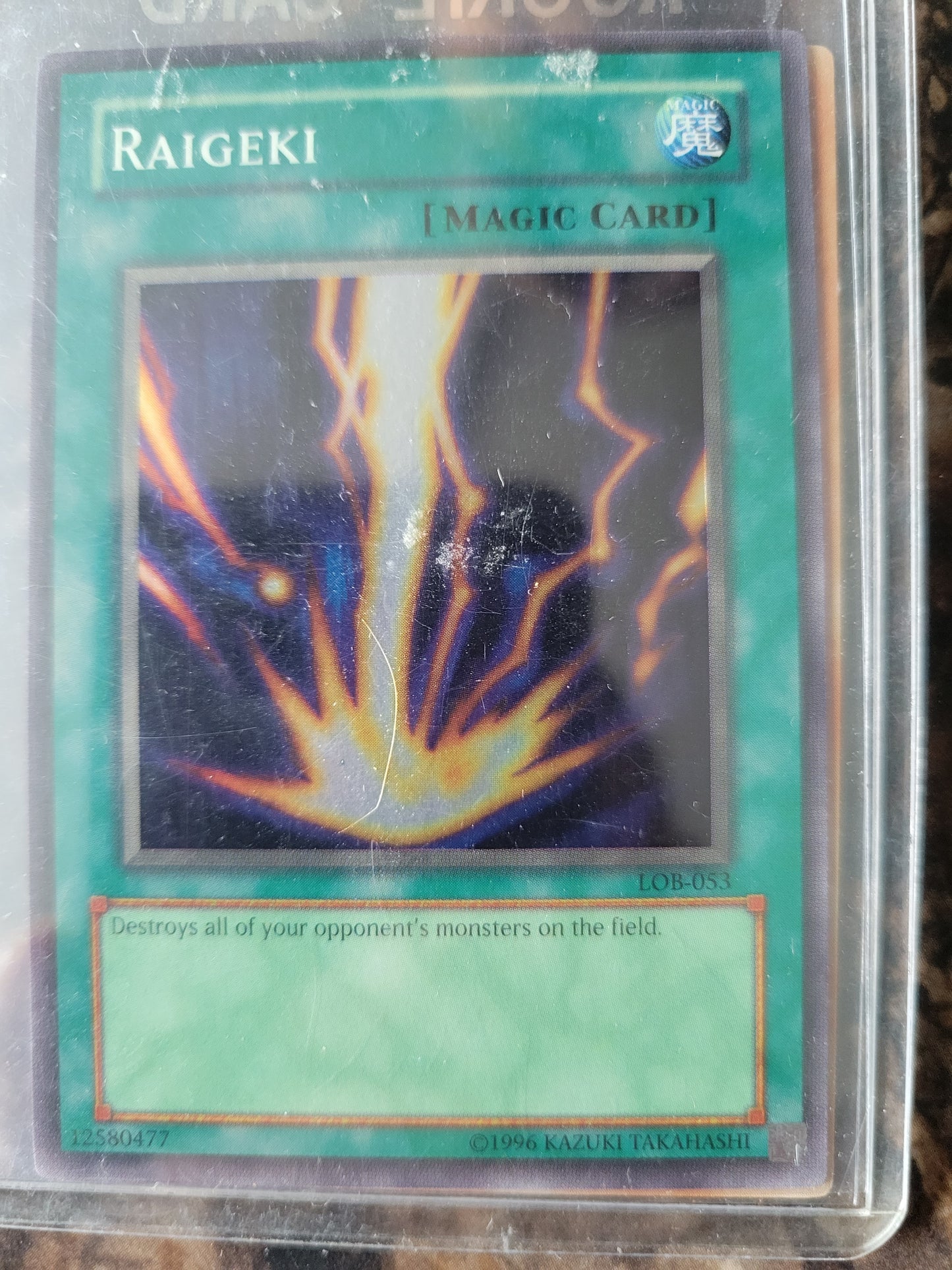 Authentic 1999 Edition LOB-053 "RAIGEKI" Yugioh Card Ultra Rare Holographic Limited Edition Near Mint Plastic Sleeve Since New